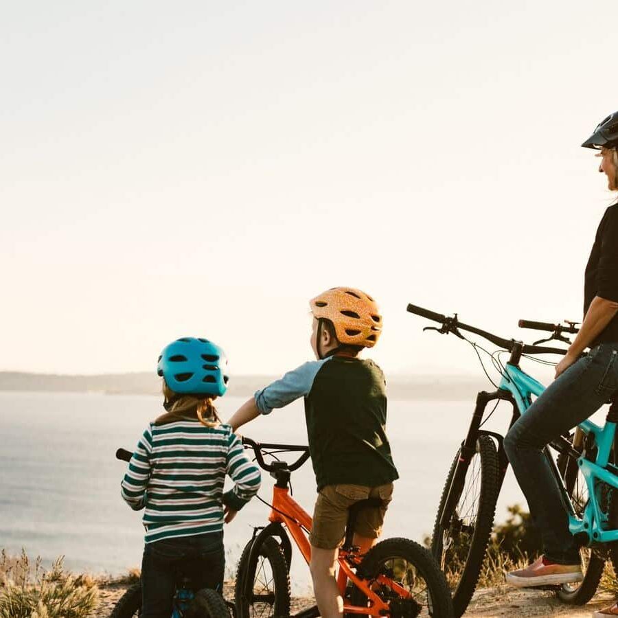 Seattle Family Mountain Bike Riding Together on Sunny Day